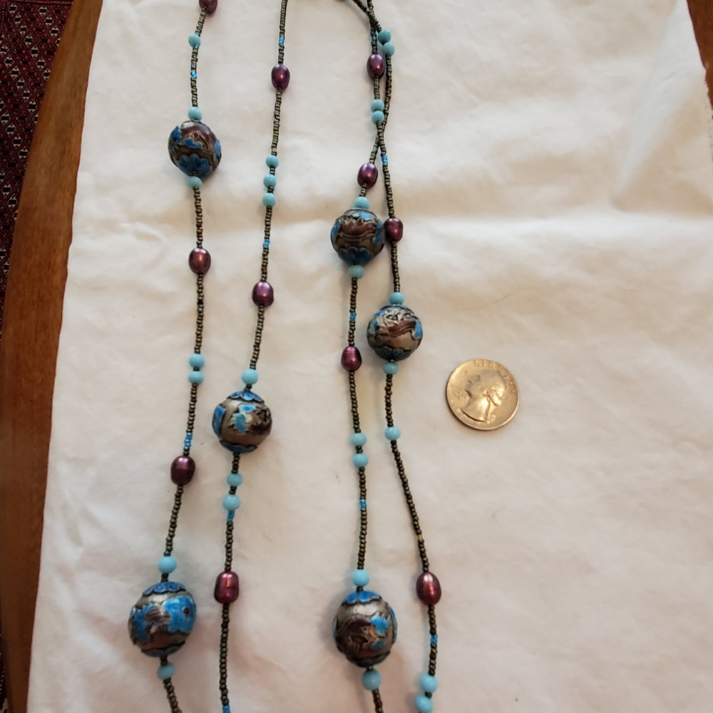 Long chain necklace with unique blue beading